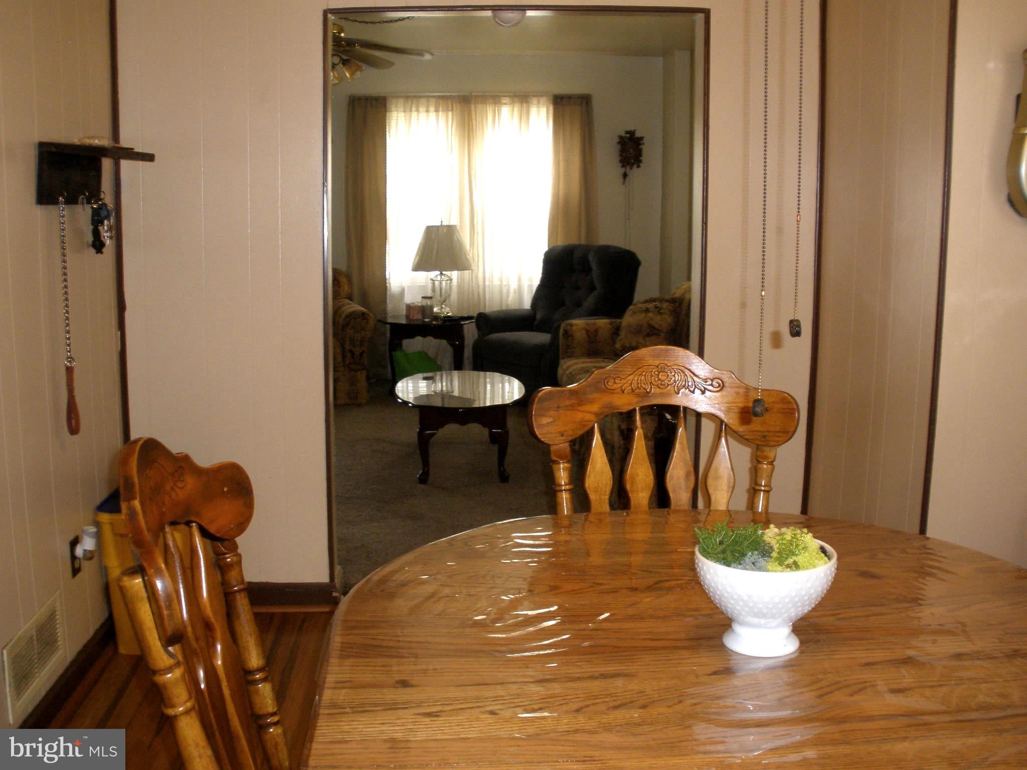2220 Vailthorn Road Baltimore, MD 21220 - Photo 15 of 34 Dining Room Into Living Room