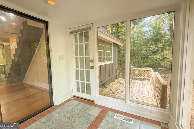 a view of an entryway with wooden floor