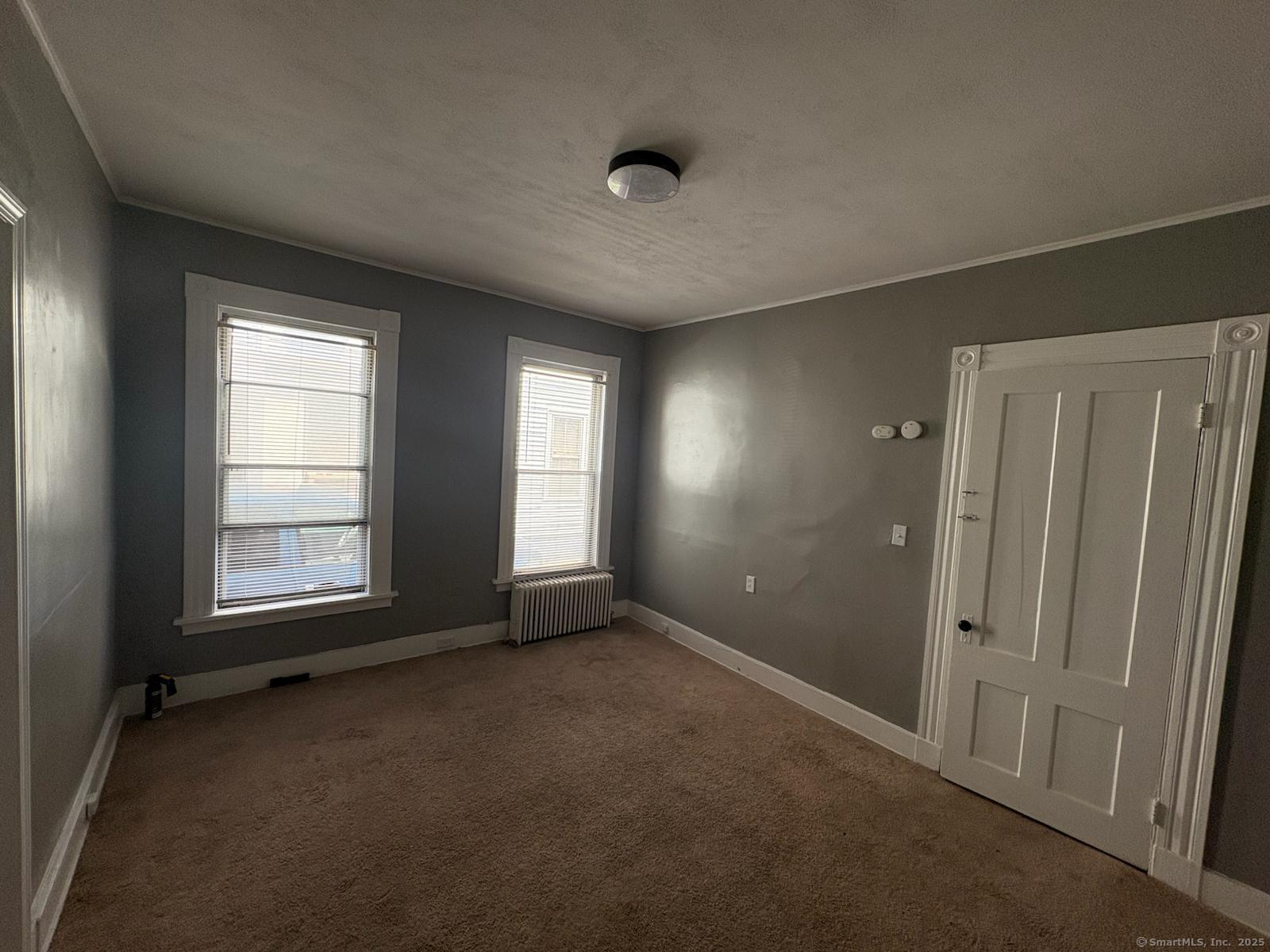 319 Sherman Avenue New Haven, CT 06511 - Photo 17 of 19 an empty room with windows and closet