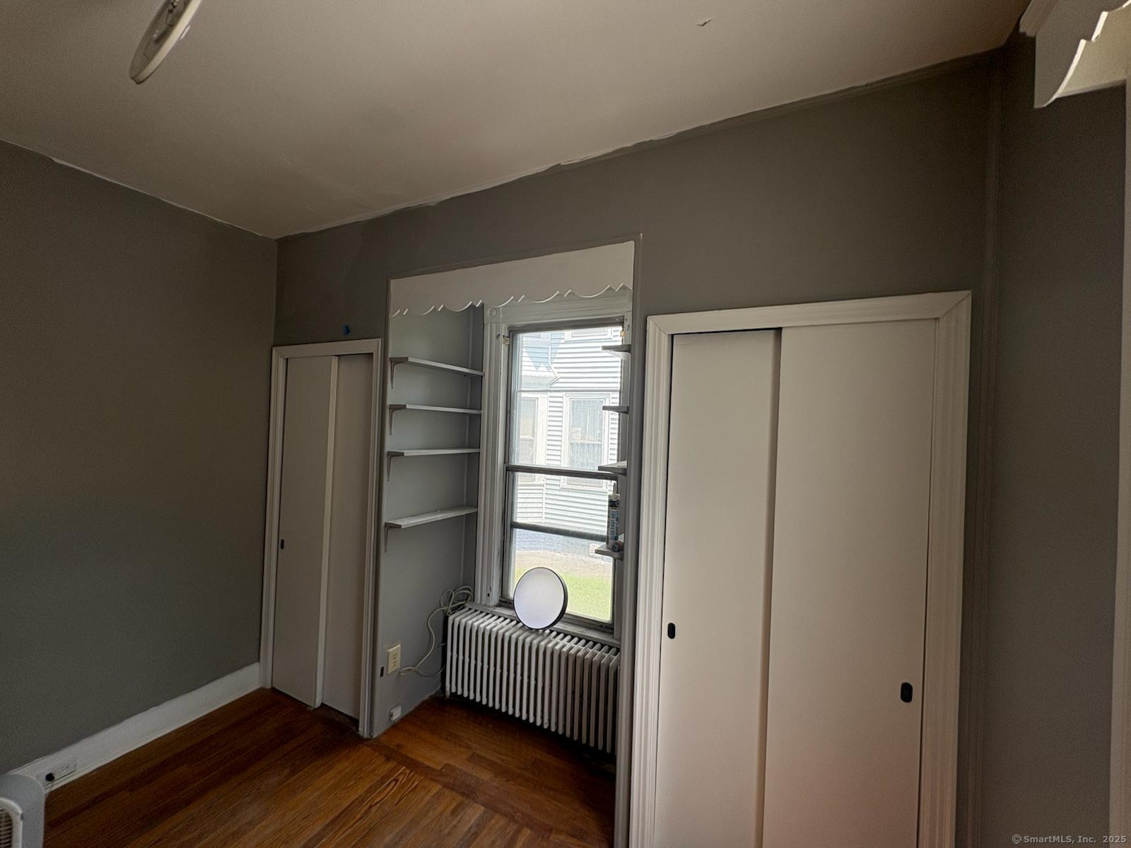 319 Sherman Avenue New Haven, CT 06511 - Photo 18 of 19 a room with wooden floor and closet