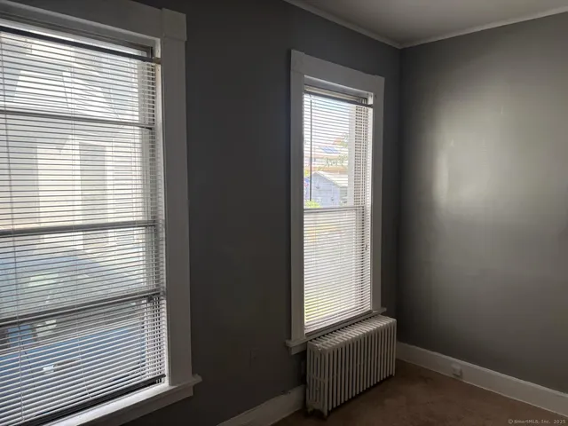 a view of a room that has a window and outside bathroom