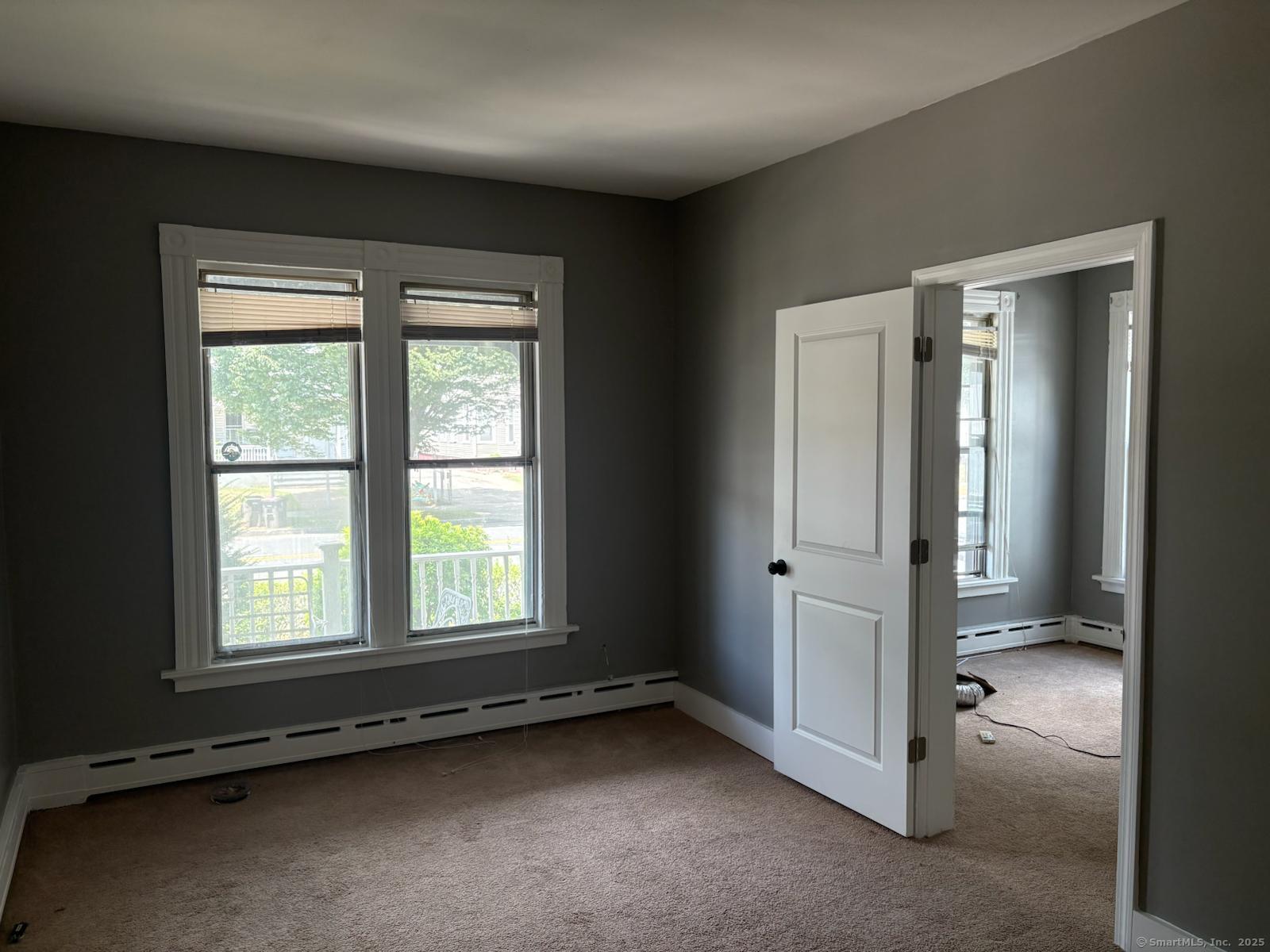 319 Sherman Avenue New Haven, CT 06511 - Photo 5 of 19 an empty room with a empty space and windows