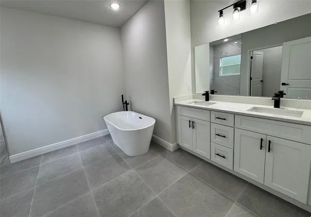 a bathroom with a shower and a sink