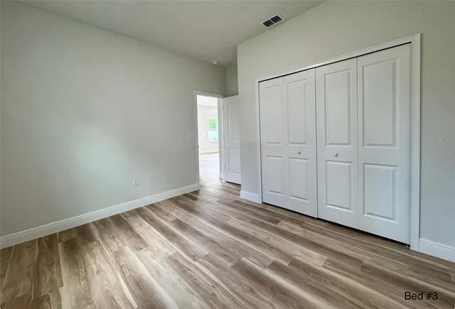 a view of a livingroom with wooden floor