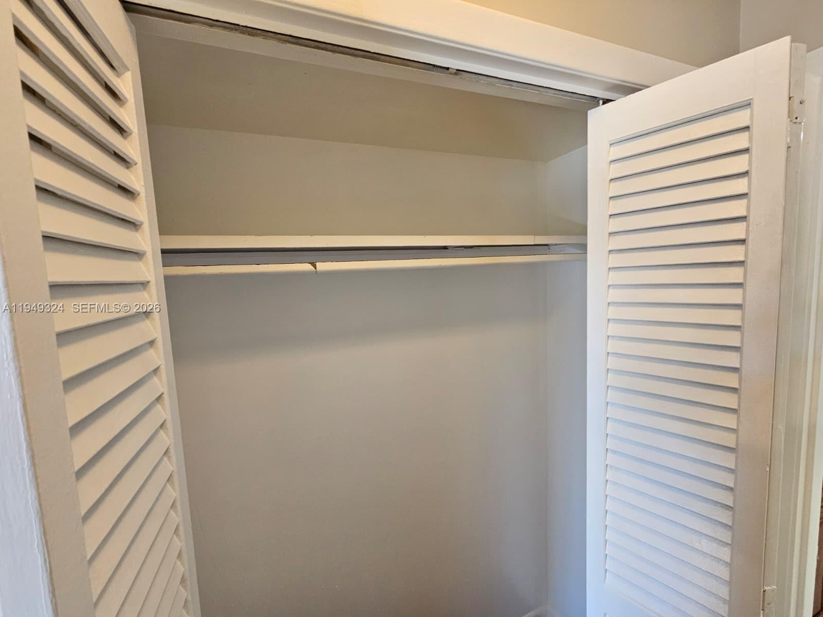 642 Northwest 13th Street, Unit 310 Boca Raton, FL 33486 - Photo 14 of 32 a close view of closet