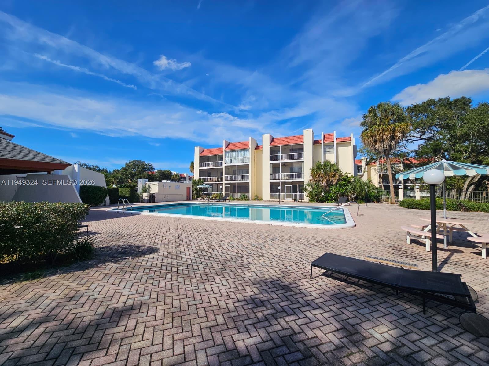 642 Northwest 13th Street, Unit 310 Boca Raton, FL 33486 - Photo 32 of 32 a view of a lake with a car park in front of it