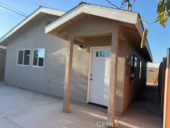 a kitchen with kitchen island granite countertop a sink and a stove top oven