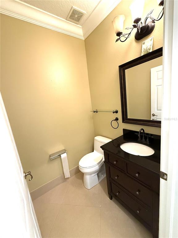 3865 Northwest Deer Oak Drive Jensen Beach, FL 34957 - Photo 21 of 34 a bathroom with a granite countertop sink toilet and mirror
