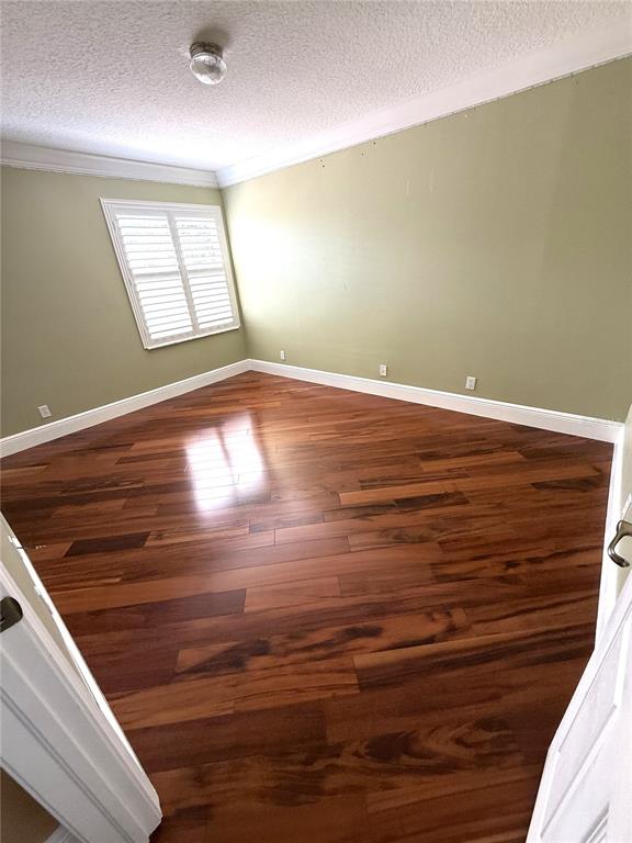3865 Northwest Deer Oak Drive Jensen Beach, FL 34957 - Photo 27 of 34 a view of empty room with window and wooden floor