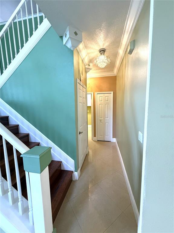 3865 Northwest Deer Oak Drive Jensen Beach, FL 34957 - Photo 7 of 34 a view of a hallway view with staircase