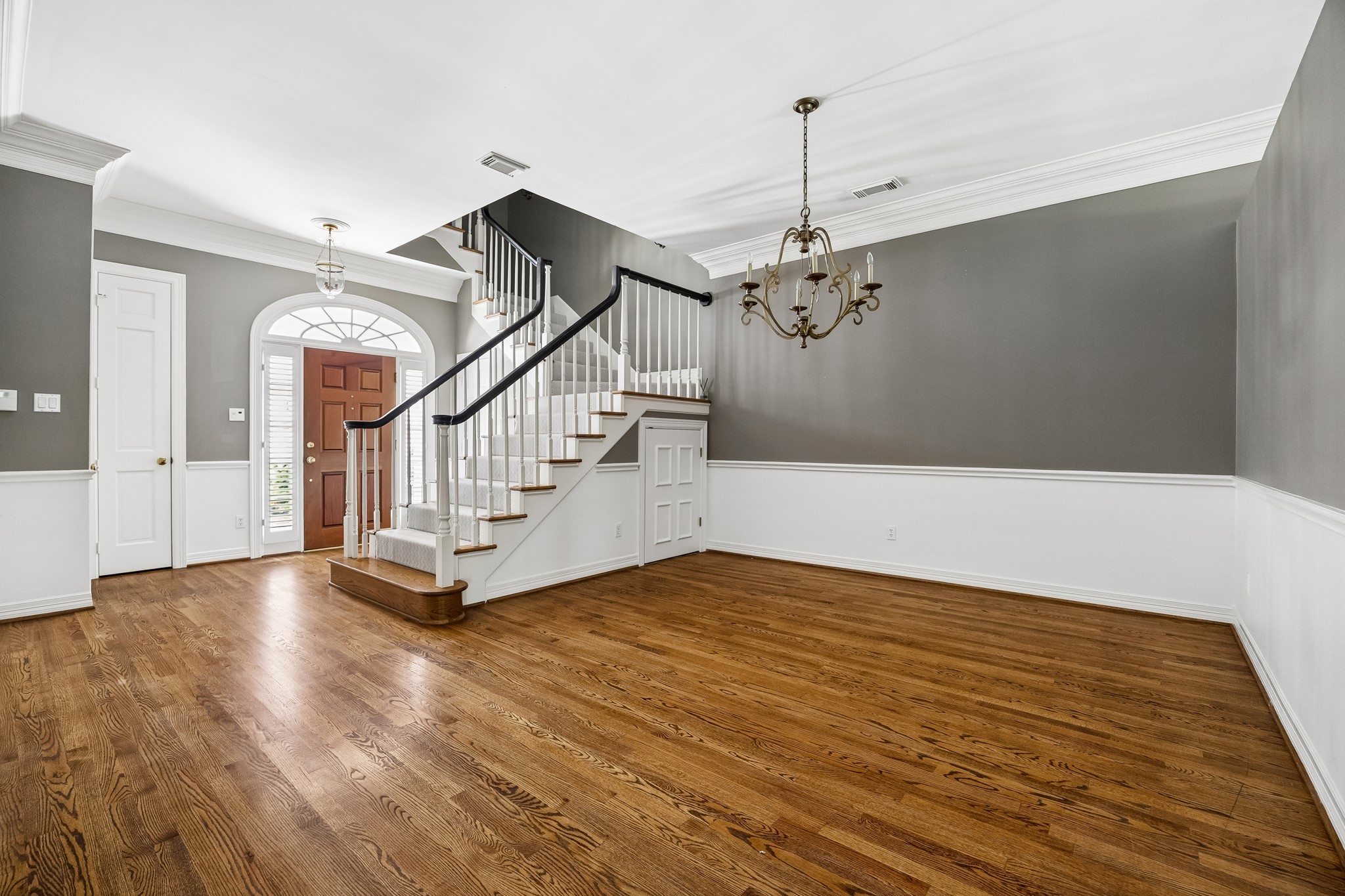 6022 Burgoyne Road Houston, TX 77057 - Photo 13 of 30 Generous formal dining room with hardwood floors, wainscoting, crown molding, and ample space for entertaining.