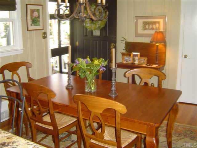 2839 Oberry Street Raleigh, NC 27607 - Photo 4 of 9 a dining room with furniture and wooden floor