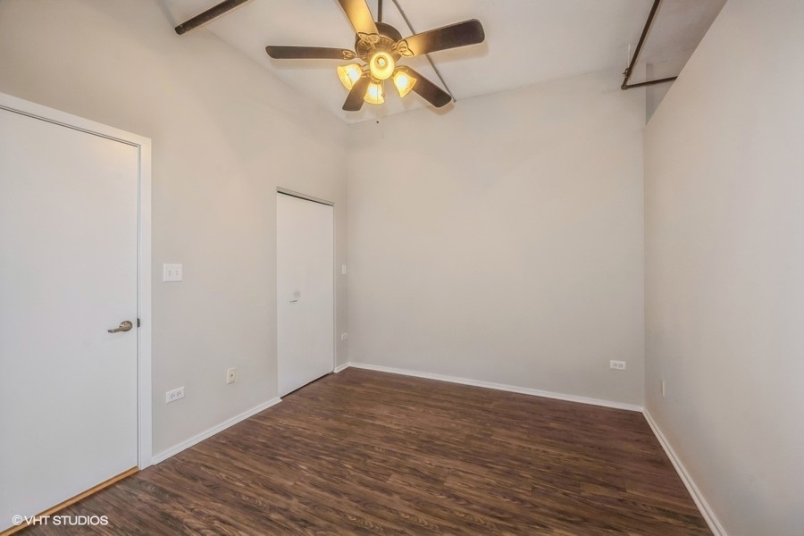 520 South State Street, Unit 702 Chicago, IL 60605 - Photo 11 of 20 a view of empty room with wooden floor