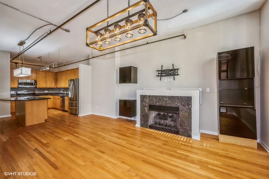 520 South State Street, Unit 702 Chicago, IL 60605 - Photo 4 of 20 a view of a kitchen with a stove and a kitchen view