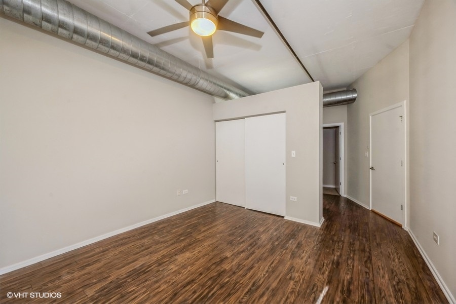 520 South State Street, Unit 702 Chicago, IL 60605 - Photo 10 of 20 wooden floor in an empty room