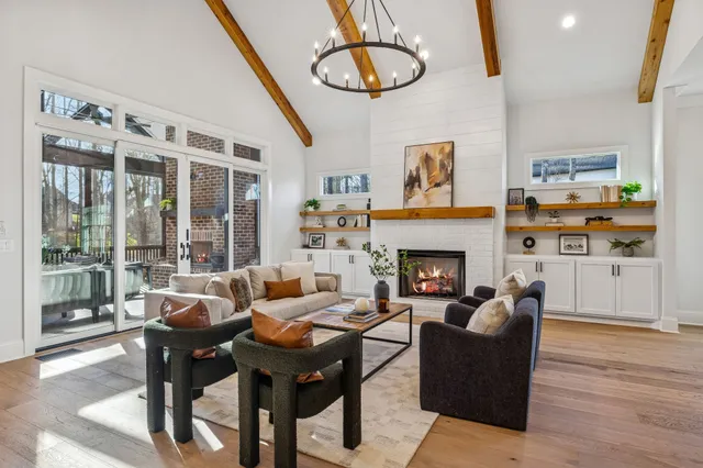 a kitchen with granite countertop a sink appliances and dining table