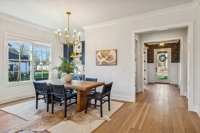 a kitchen with lots of counter top space and wooden floor