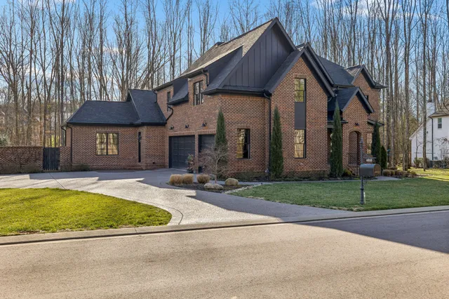 a view of a hallway view with wooden floor and staircase