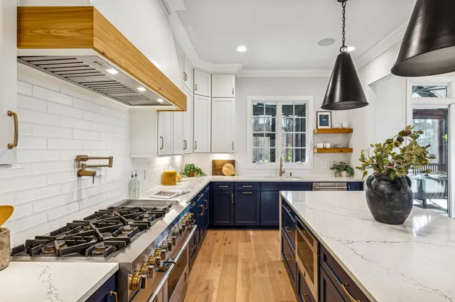 a bath room with a sink a mirror and a shower