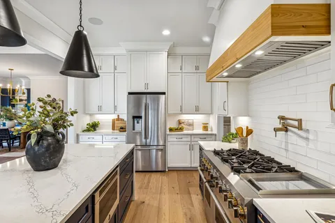 a bathroom with a sink a mirror and a bathtub