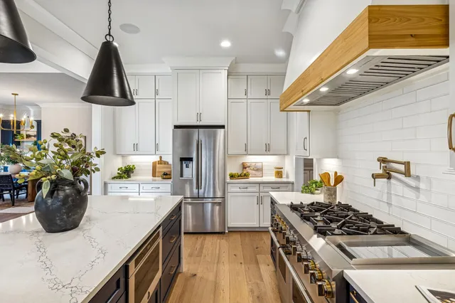 a bathroom with a sink a mirror and a bathtub