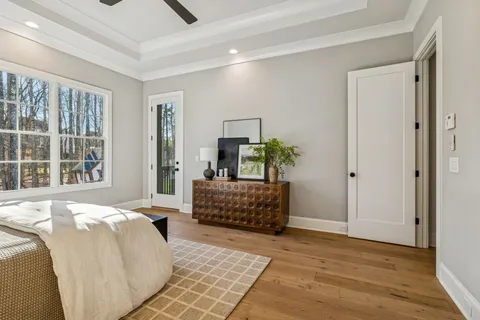 a living room with furniture a rug and a chandelier