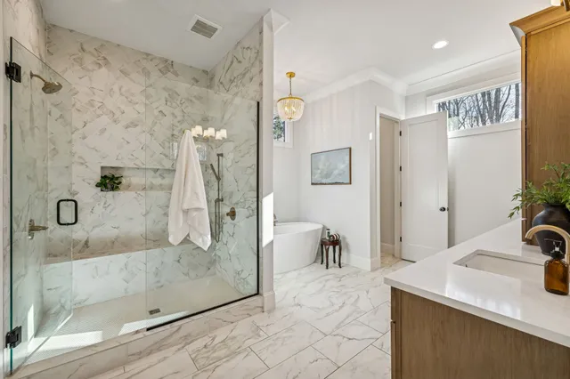 an empty room with windows and ceiling fan