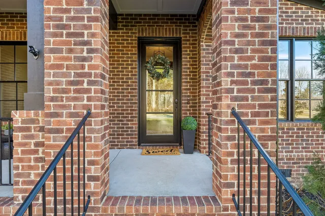 a view of a hallway view with wooden floor and staircase