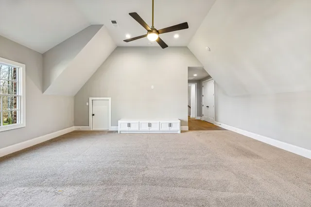 an aerial view of a house with garden space and street view