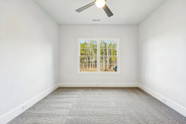 an aerial view of a swimming pool with outdoor seating and yard