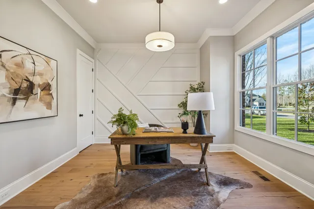 a living room with furniture a fireplace and kitchen view