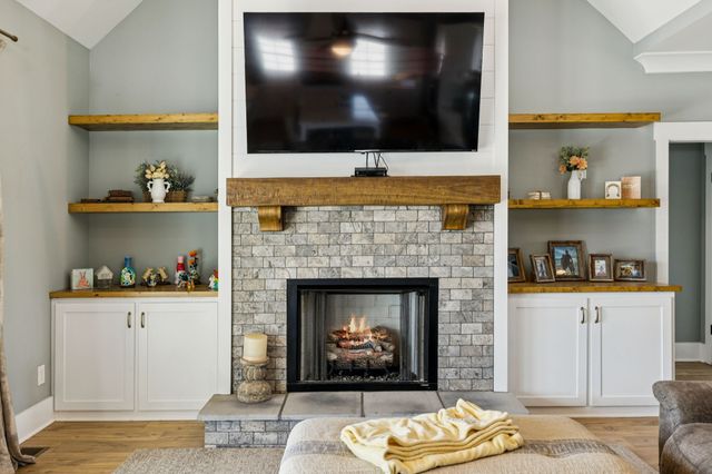 a large white kitchen with a stove and a sink