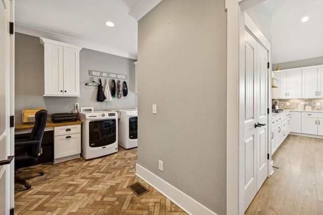 a bathroom with a granite countertop sink mirror and double