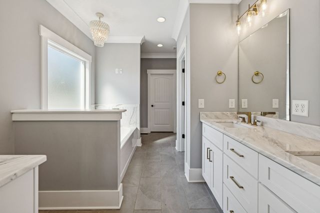 a view of storage and utility room with a hallway