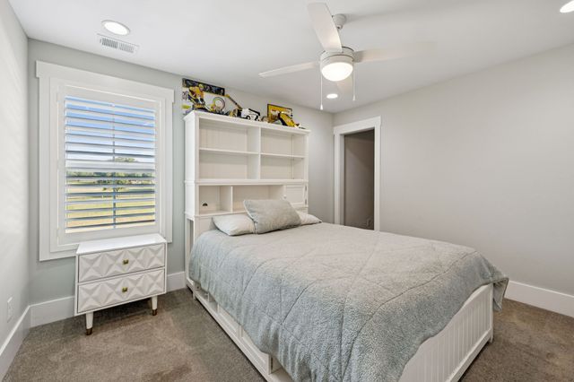 a view of swimming pool with seating space