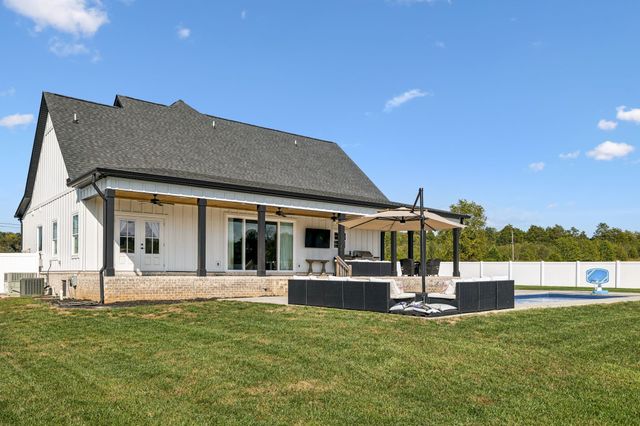 a house with trees in the background