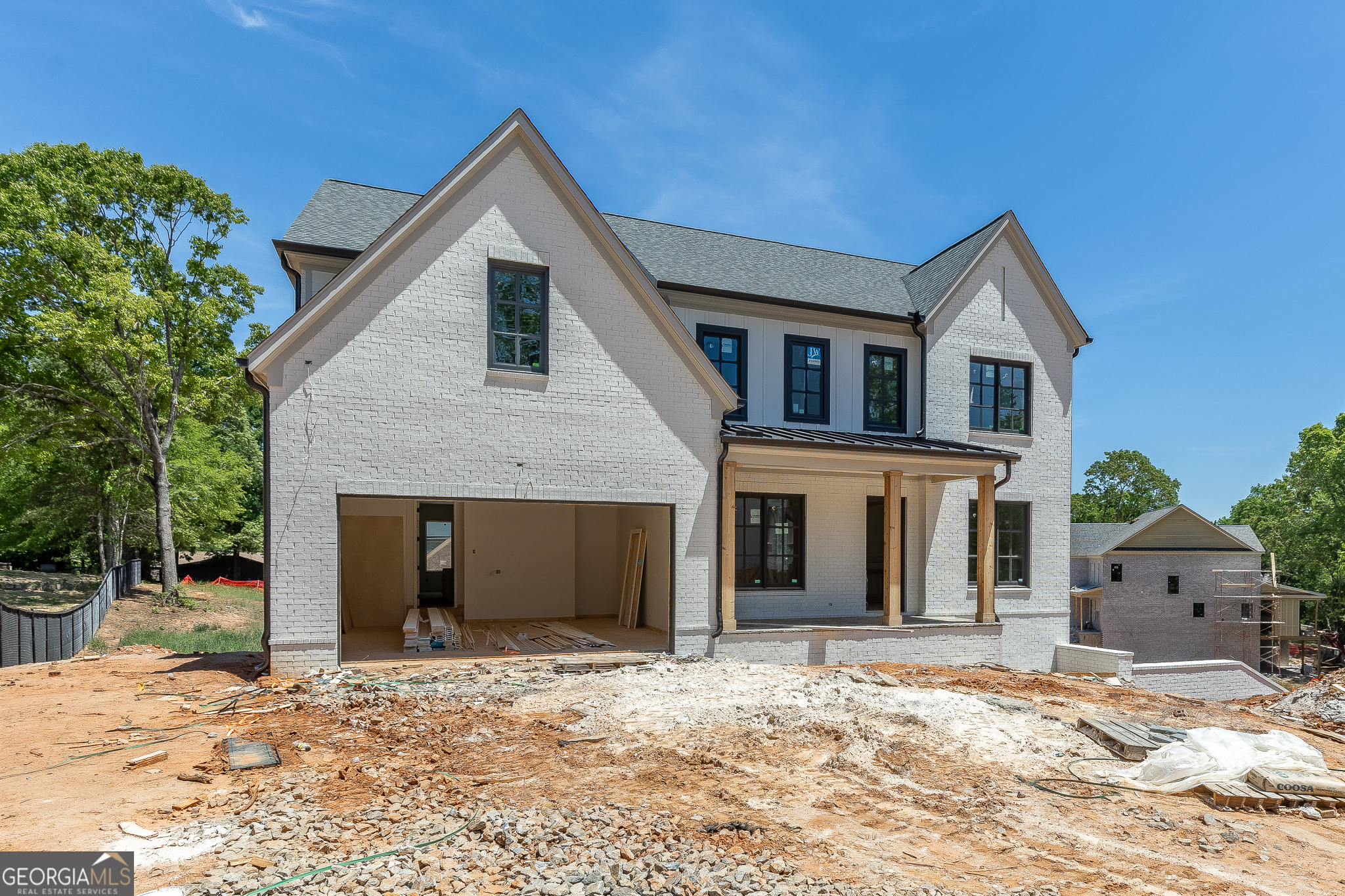 2969 North Bogan Road Northeast, Unit 1 Buford, GA 30519 - Photo 5 of 51 a front view of a house with a yard