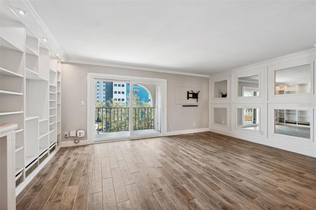 105 4th Avenue Northeast, Unit 418 St. Petersburg, FL 33701 - Photo 14 of 42 wooden floor in an empty room with a window