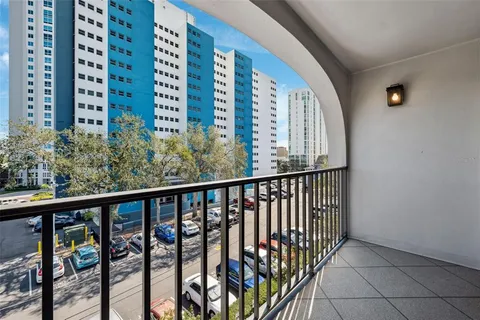 a view of a patio with table and chairs and potted plants