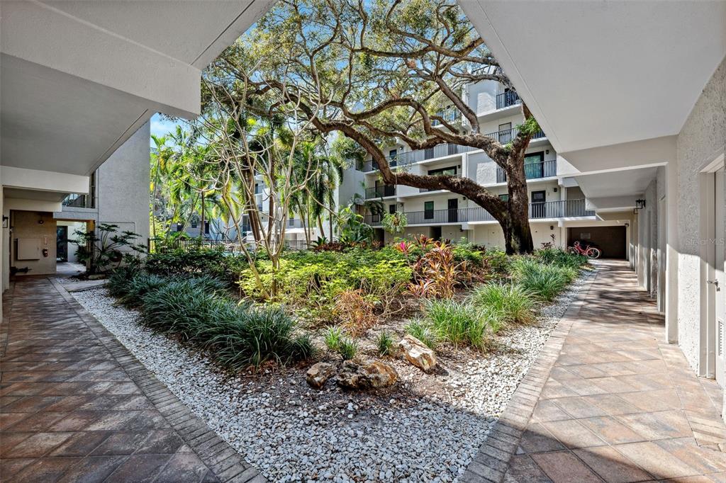 105 4th Avenue Northeast, Unit 418 St. Petersburg, FL 33701 - Photo 30 of 42 a front view of a house with a yard