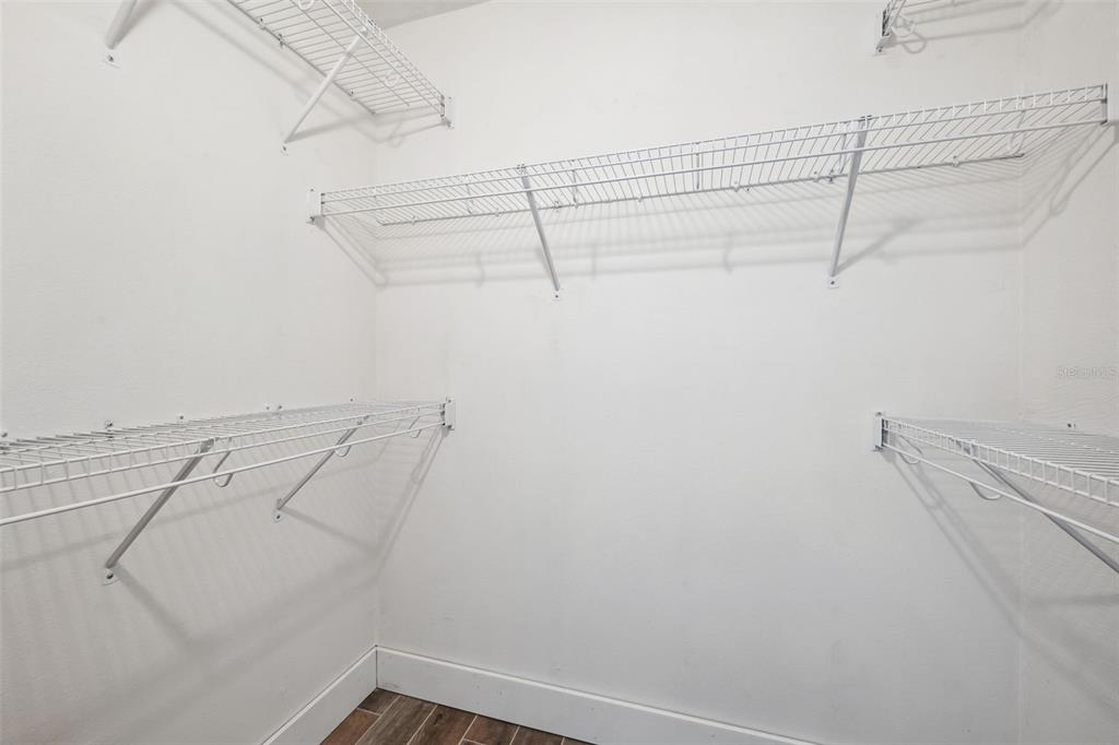 105 4th Avenue Northeast, Unit 418 St. Petersburg, FL 33701 - Photo 42 of 42 a view of a room with racks on the wall