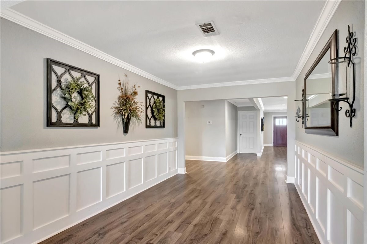 12335 2nd Street Santa Fe, TX 77539 - Photo 13 of 49 a view of a hallway with wooden floor