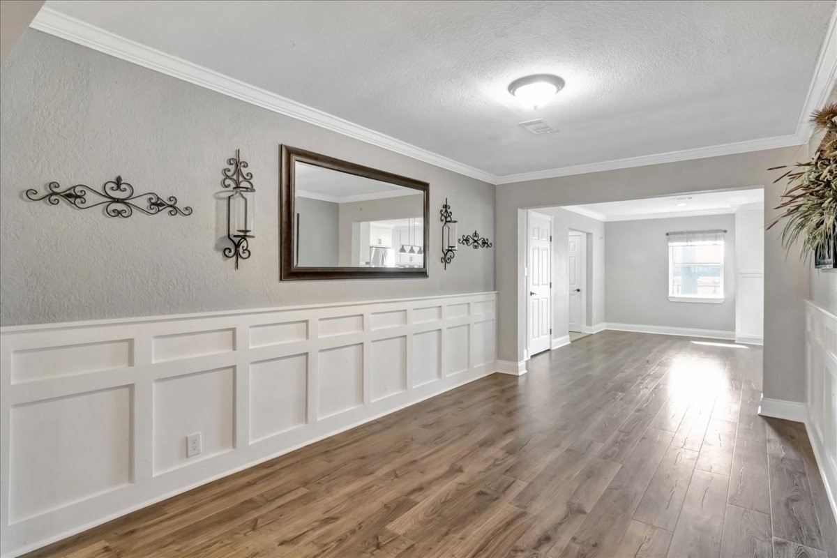 12335 2nd Street Santa Fe, TX 77539 - Photo 14 of 49 a view of a room with wooden floor and cabinet
