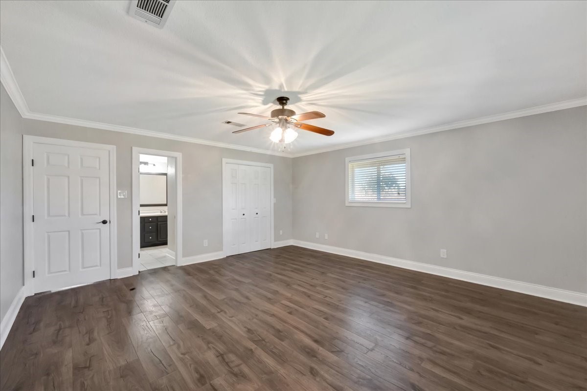 12335 2nd Street Santa Fe, TX 77539 - Photo 27 of 49 wooden floor in an empty room with a window