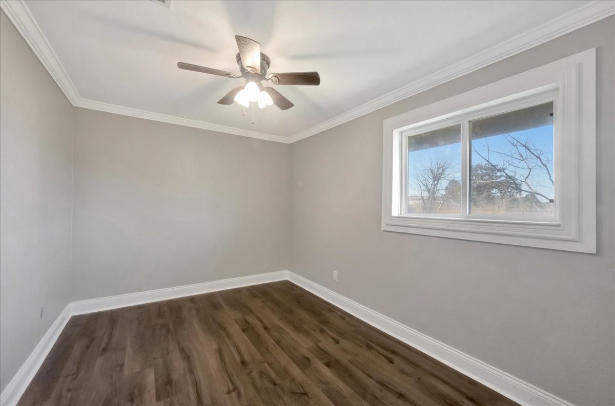 12335 2nd Street Santa Fe, TX 77539 - Photo 30 of 49 a view of wooden floor and chandelier fan in a room
