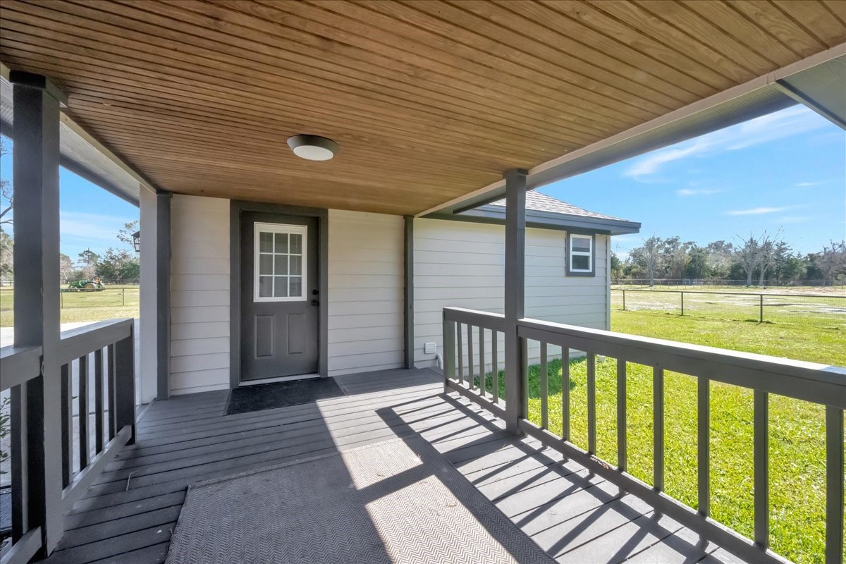 12335 2nd Street Santa Fe, TX 77539 - Photo 37 of 49 a view of a porch with wooden floor