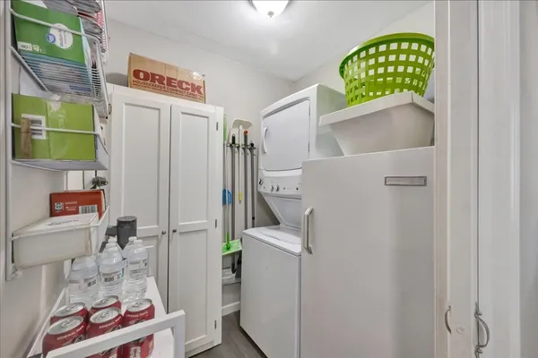 a bathroom with a granite countertop sink and a shower curtain