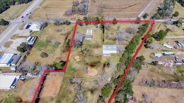 an aerial view of residential houses with outdoor space