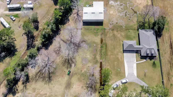 an aerial view of a house with swimming pool