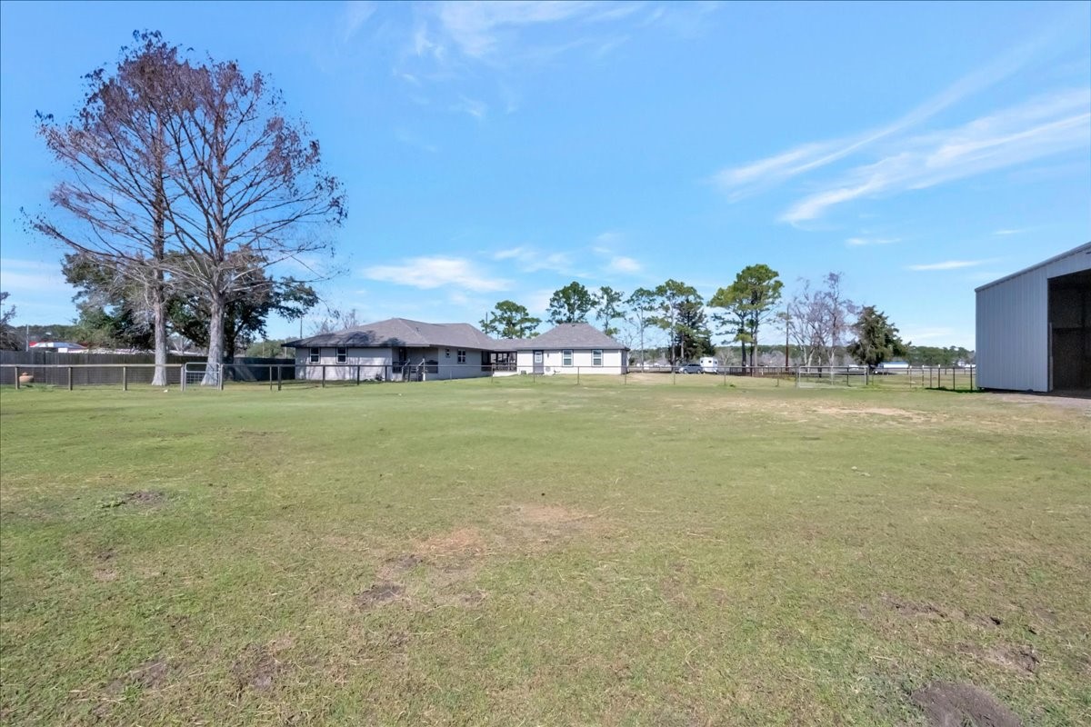 12335 2nd Street Santa Fe, TX 77539 - Photo 5 of 49 a view of a field with houses in background